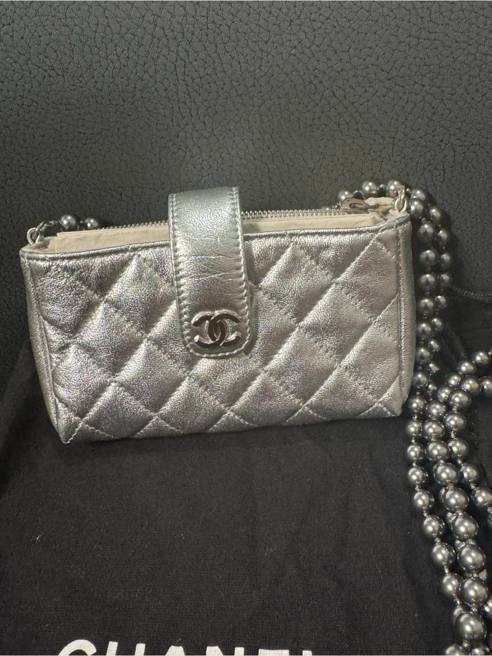CHANEL Silver Quilted Leather O-Phone Holder with Pearl Chain.